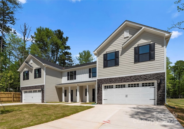 1604 Breezewood Dr, Charlotte, NC 28262 - traditional-style house featuring a garage, concrete driveway, and stone siding