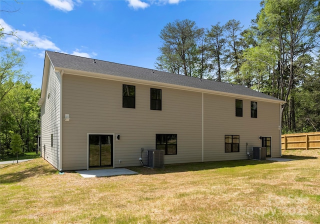 1604 Breezewood Dr, Charlotte, NC 28262 - back of house featuring fence, a yard, and cooling unit