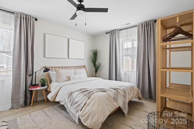 192 Duckworth Ave, Brevard, NC 28712 - bedroom with light wood-style flooring and a ceiling fan