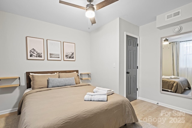 192 Duckworth Ave, Brevard, NC 28712 - bedroom with light wood-style floors and ceiling fan