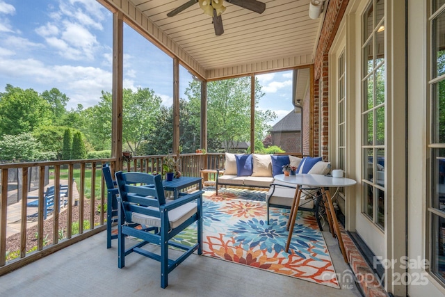 sunroom / solarium with an outdoor hangout area and a ceiling fan