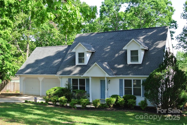 177 Line Dr, Forest City, NC 28043 - new england style home featuring fence, a shingled roof, a front lawn, a garage, and concrete driveway