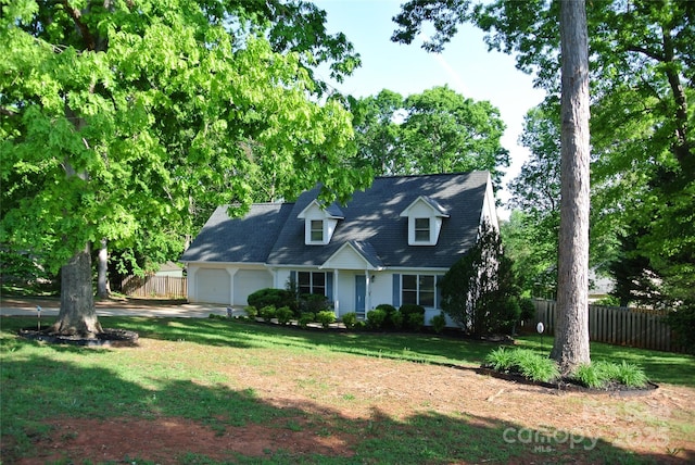 177 Line Dr, Forest City, NC 28043 - new england style home featuring a garage, a front lawn, fence, and driveway
