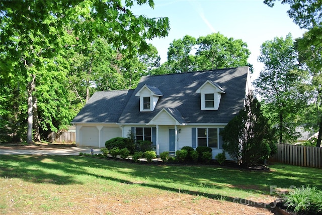 177 Line Dr, Forest City, NC 28043 - new england style home with concrete driveway, fence, a front yard, and a garage
