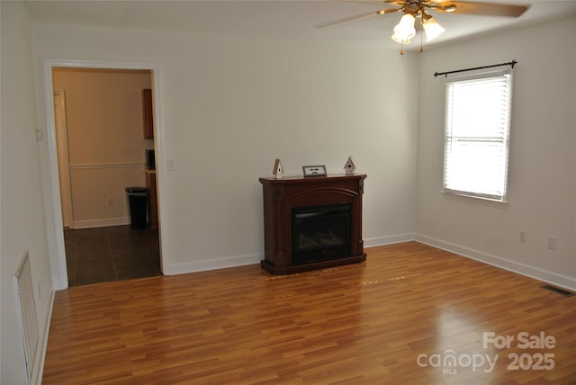 177 Line Dr, Forest City, NC 28043 - living room featuring a ceiling fan, baseboards, visible vents, and wood finished floors
