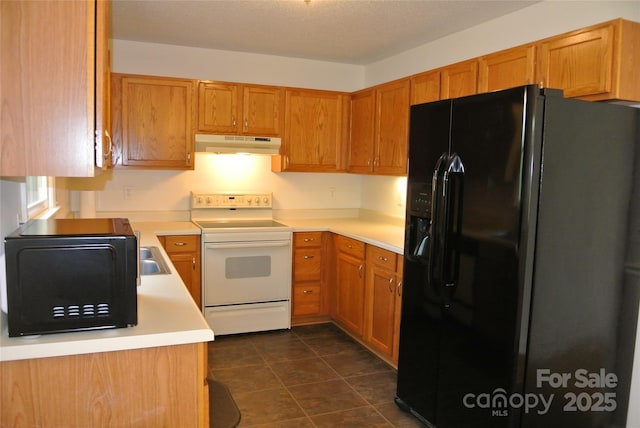 177 Line Dr, Forest City, NC 28043 - kitchen featuring light countertops, brown cabinetry, under cabinet range hood, dark tile patterned floors, and black appliances