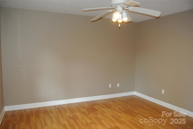 177 Line Dr, Forest City, NC 28043 - unfurnished room featuring a ceiling fan, baseboards, and light wood-style floors