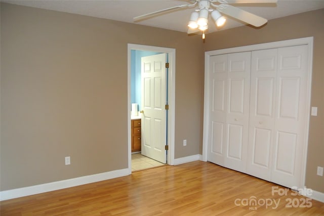 177 Line Dr, Forest City, NC 28043 - unfurnished bedroom with baseboards, light wood-style flooring, and a closet