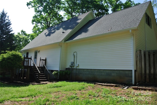 177 Line Dr, Forest City, NC 28043 - rear view of house featuring a shingled roof and fence
