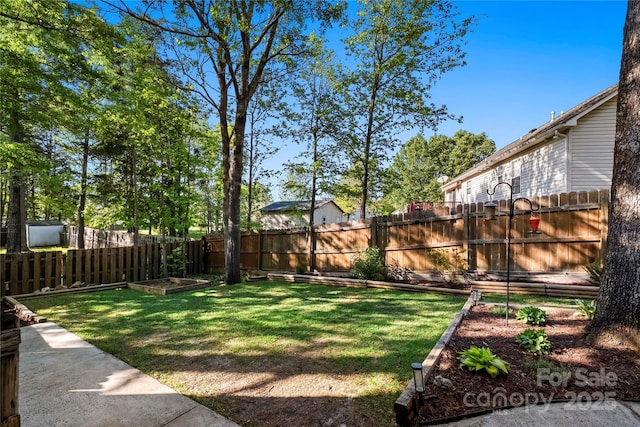 view of yard with a fenced backyard