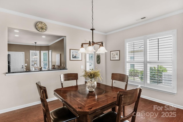 dining space featuring dark wood-style flooring, baseboards, visible vents, and a wealth of natural light