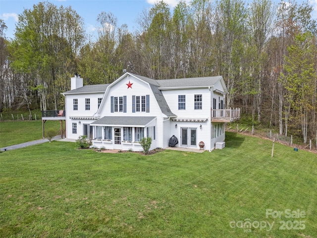 6780 Max Patch Rd, Clyde, NC 28721 - rear view of property with a gambrel roof, roof with shingles, french doors, a chimney, and a yard