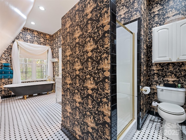 6780 Max Patch Rd, Clyde, NC 28721 - bathroom with recessed lighting, tile patterned floors, a stall shower, and toilet