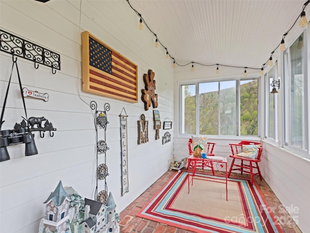 6780 Max Patch Rd, Clyde, NC 28721 - sunroom with wooden walls, wood ceiling, and brick floor