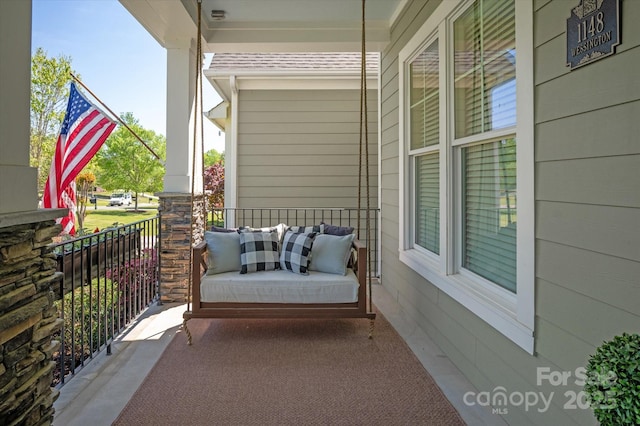 balcony featuring a porch