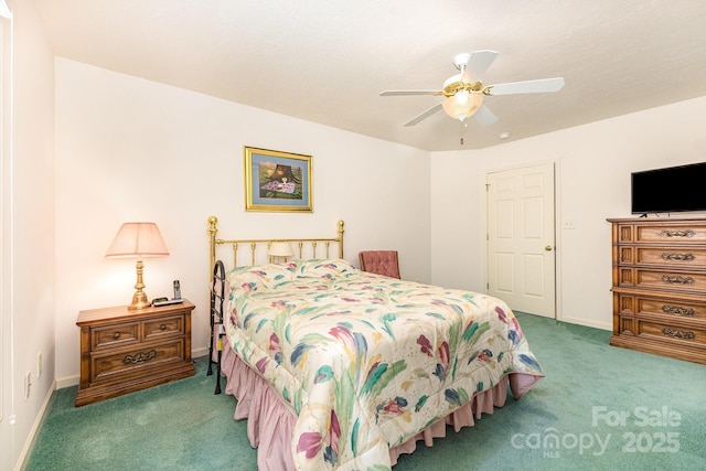 carpeted bedroom with a ceiling fan and baseboards