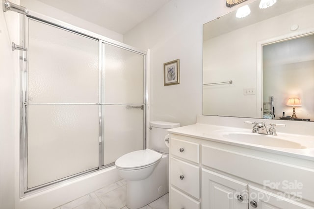 full bathroom featuring toilet, a stall shower, vanity, and marble look tile flooring