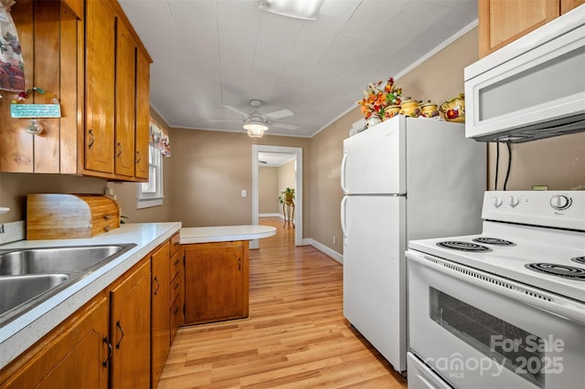 kitchen featuring light countertops, ornamental molding, brown cabinetry, and white appliances