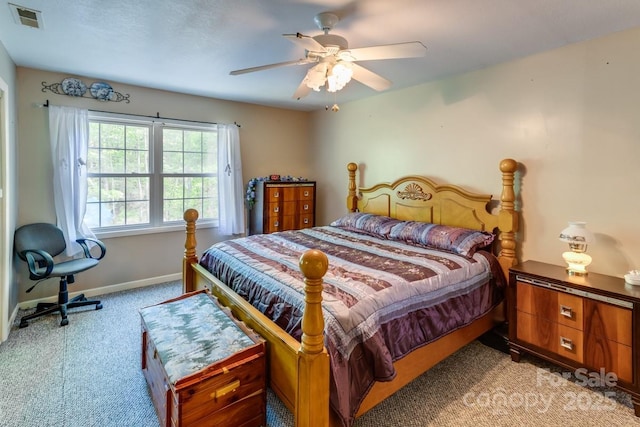 bedroom featuring carpet flooring, a ceiling fan, baseboards, and visible vents