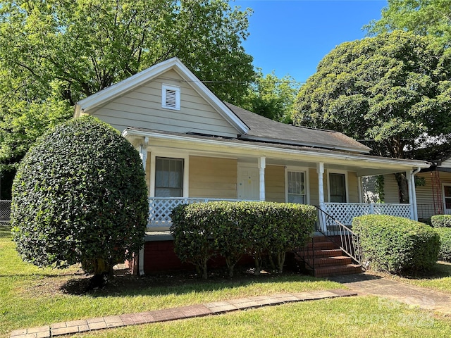 2433 Booker Ave, Charlotte, NC 28216 - view of front facade featuring covered porch and a front lawn