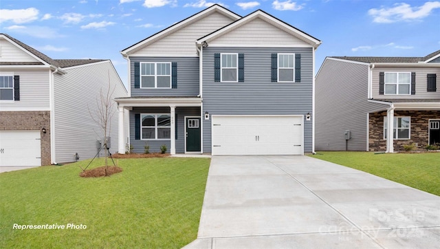 craftsman-style house with a garage, driveway, and a front yard