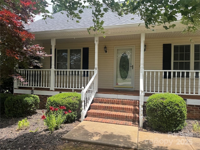 165 Graceland Pl, Salisbury, NC 28146 - property entrance with a porch and roof with shingles