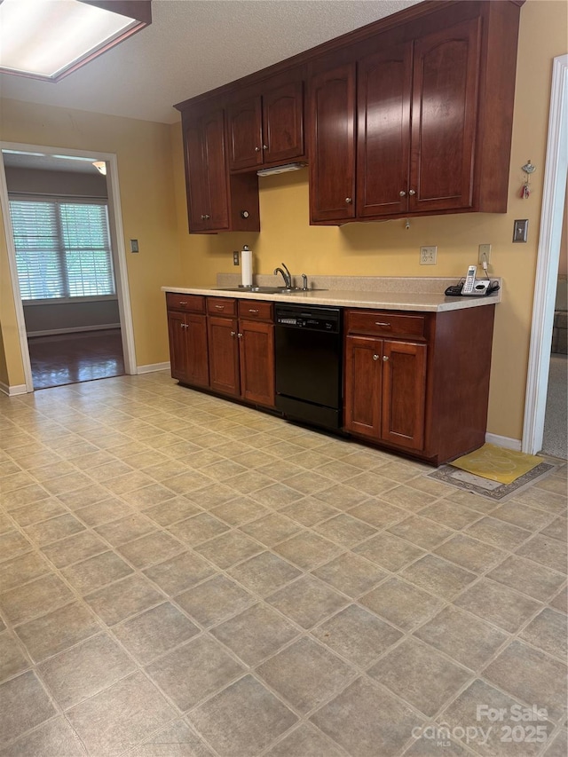 165 Graceland Pl, Salisbury, NC 28146 - kitchen featuring dishwasher, baseboards, light countertops, and a sink