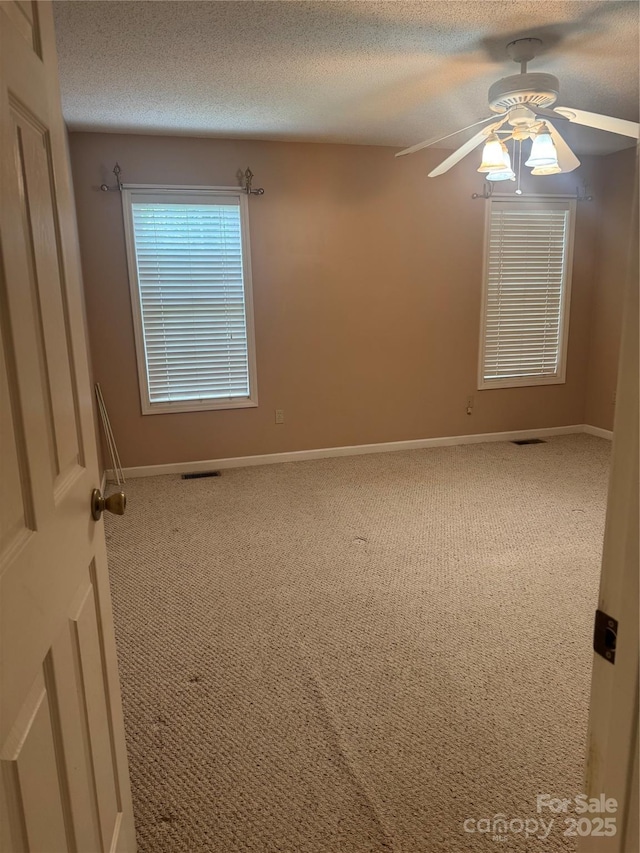165 Graceland Pl, Salisbury, NC 28146 - empty room featuring carpet floors, baseboards, ceiling fan, and a textured ceiling