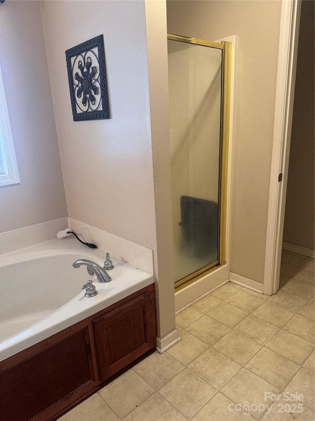 165 Graceland Pl, Salisbury, NC 28146 - full bath with a stall shower, a garden tub, and tile patterned floors