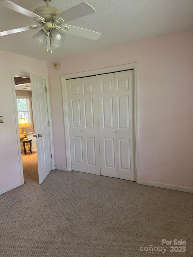 165 Graceland Pl, Salisbury, NC 28146 - unfurnished bedroom featuring light carpet, baseboards, a closet, and ceiling fan