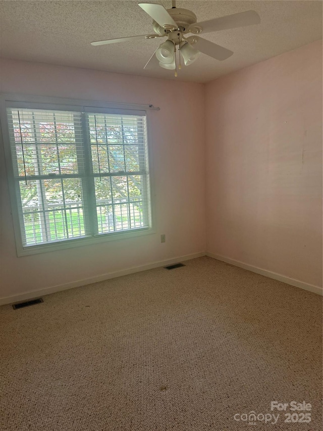 165 Graceland Pl, Salisbury, NC 28146 - unfurnished room featuring light colored carpet, baseboards, a ceiling fan, and a textured ceiling