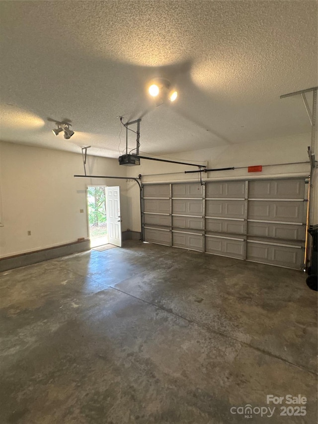 165 Graceland Pl, Salisbury, NC 28146 - garage with a garage door opener and baseboards