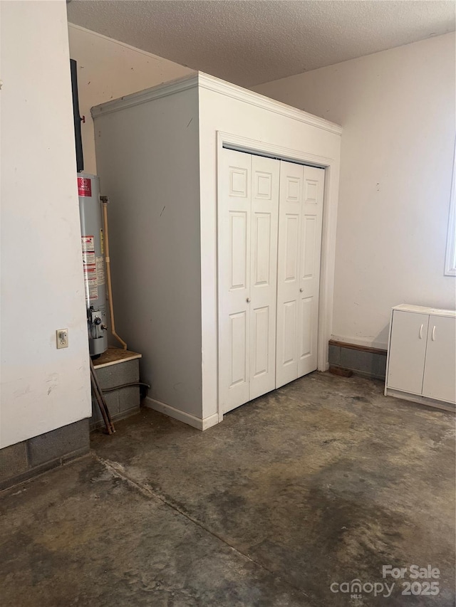 165 Graceland Pl, Salisbury, NC 28146 - unfurnished bedroom with water heater, a closet, a textured ceiling, and unfinished concrete flooring