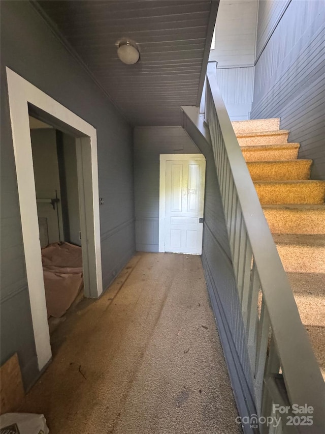 interior space featuring carpet floors and stairway