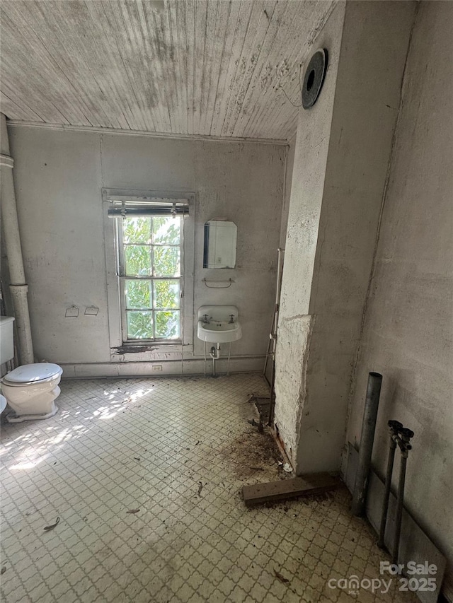 miscellaneous room with tile patterned floors and wood ceiling