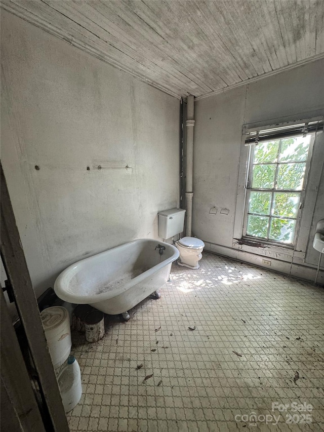 bathroom with wooden ceiling, toilet, and tile patterned floors