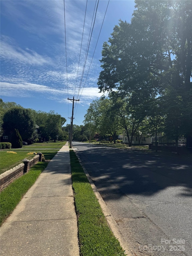 view of street featuring curbs and sidewalks