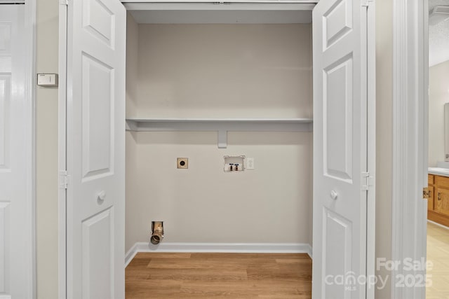 laundry room with hookup for an electric dryer, laundry area, light wood-type flooring, baseboards, and hookup for a washing machine