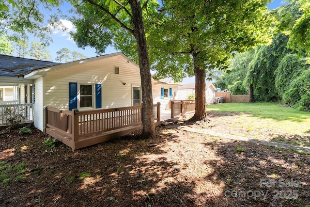 back of property featuring a wooden deck