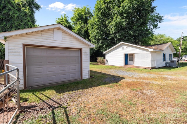 detached garage featuring driveway