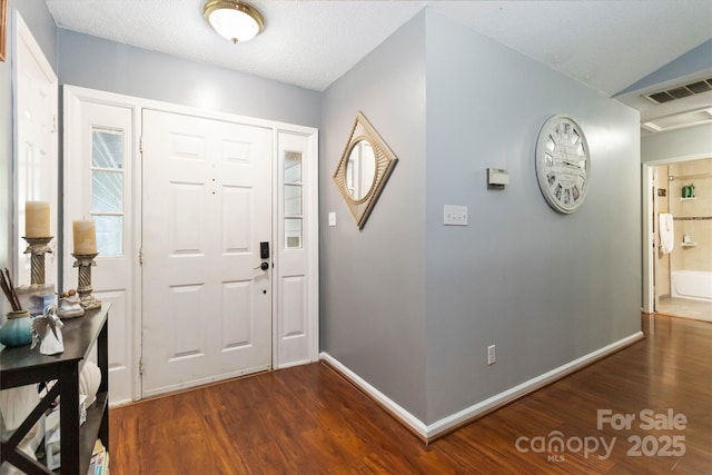 6736 Raeburn Ln, Charlotte, NC 28227 - foyer featuring baseboards, dark wood-style flooring, and visible vents