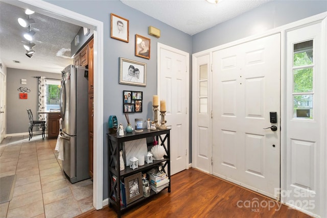 6736 Raeburn Ln, Charlotte, NC 28227 - entrance foyer featuring baseboards and a textured ceiling