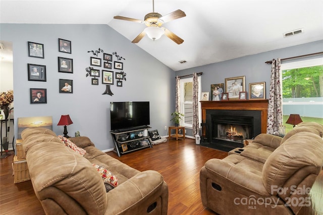 6736 Raeburn Ln, Charlotte, NC 28227 - living area featuring visible vents, a ceiling fan, wood finished floors, and vaulted ceiling