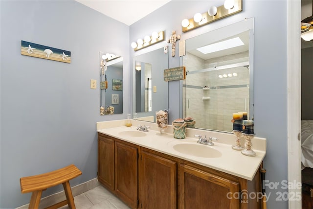 6736 Raeburn Ln, Charlotte, NC 28227 - full bathroom featuring double vanity, a sink, tile patterned floors, and a shower stall