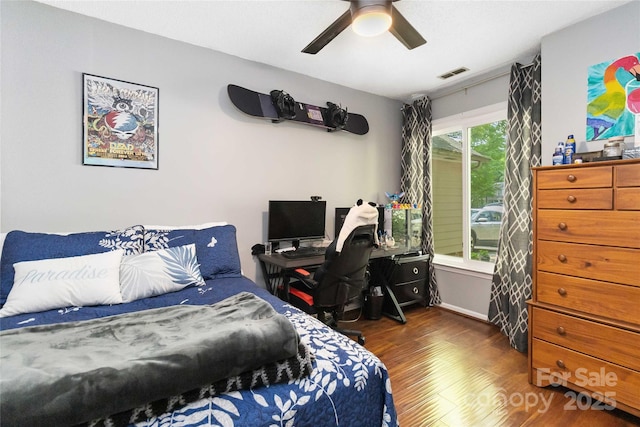 6736 Raeburn Ln, Charlotte, NC 28227 - bedroom with ceiling fan, visible vents, and wood finished floors