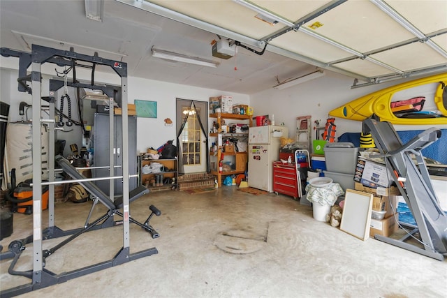 6736 Raeburn Ln, Charlotte, NC 28227 - garage featuring freestanding refrigerator and a garage door opener