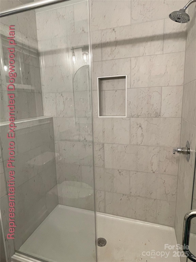 bathroom with a shower stall