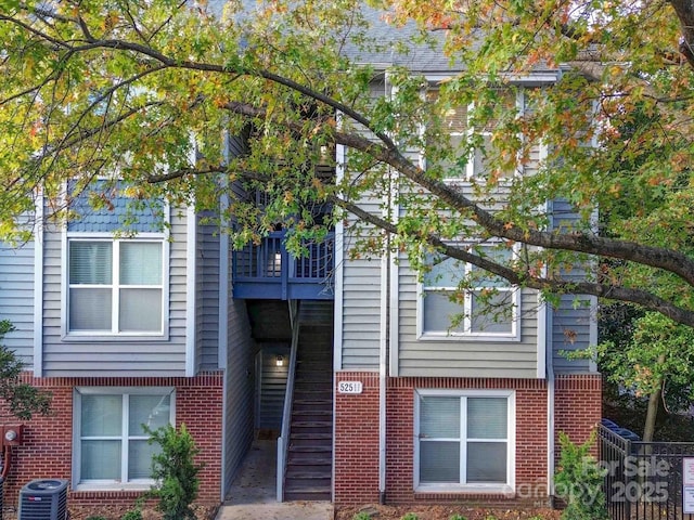 525 N Graham St Unit 3F, Charlotte, NC 28202 - view of front of house with a balcony, cooling unit, and brick siding