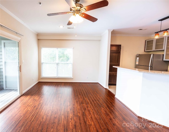525 N Graham St Unit 3F, Charlotte, NC 28202 - unfurnished living room with crown molding, baseboards, a ceiling fan, and dark wood-style flooring