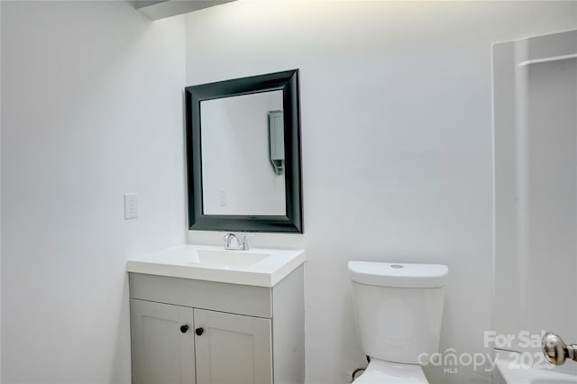 bathroom with vanity and toilet